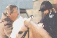 Geoff tempts Lizzie to a sweetie