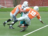 Green has the ball and is tackled