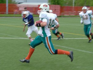 Pete Rogers scrambles for first down yardage.