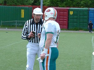 Head Coach Gary Marshall confers with the referee